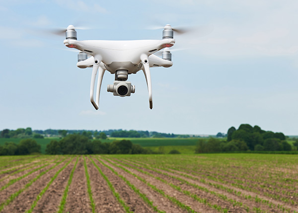 a drone flying over a field